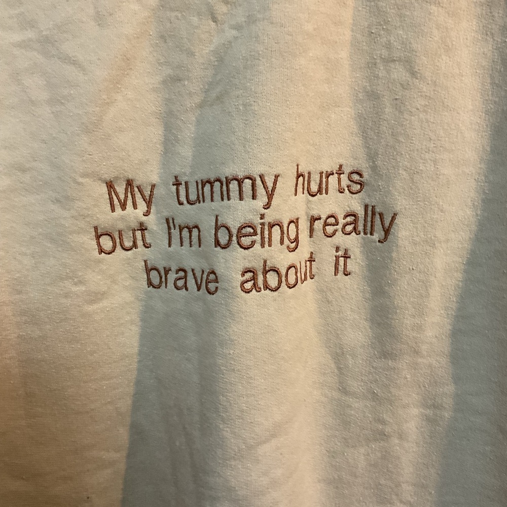 Cream Shirt with Brown Text